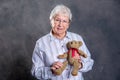 Grandmother with  is puppet doctor for teddy bear Royalty Free Stock Photo