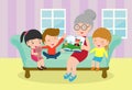 Grandmother reading fairy tales to her grandchildren, reading and telling book fairy tale story Royalty Free Stock Photo