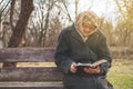 Grandmother reads the holy scripture bible. Thinking of God. Royalty Free Stock Photo