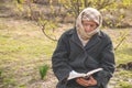 Grandmother reads the holy scripture bible. Thinking of God. Power of religion, worship, belief. Royalty Free Stock Photo