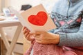 Grandmother reads a letters from children and grandchildren.