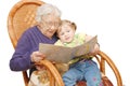 Grandmother reads to the granddaughter