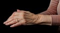 Grandmother\'s hand clutching her wrist in pain