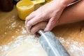 Grandmother showing child how to roll out cookie dough Royalty Free Stock Photo