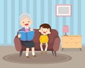 Grandmother sitting with grandchildren on sofa with the book