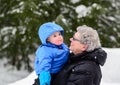 Grandmother Smiling at Grandson Outside in Winter Royalty Free Stock Photo