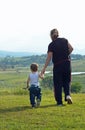 Grandmother taking grandson walk in stunning rural countryside