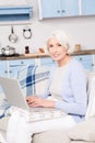 Grandmother using laptop computer Royalty Free Stock Photo