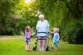 Grandmother with walker playing with two kids Royalty Free Stock Photo