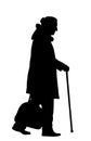 Grandmother walking with stick vector silhouette illustration isolated on white background. Royalty Free Stock Photo