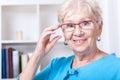 Grandmother wearing reading glasses
