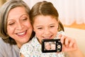 Grandmother and young girl take picture themselves