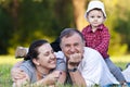 Grandpa, daughter and niece on grass Royalty Free Stock Photo