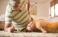 Grandpa and granddaughter playing.