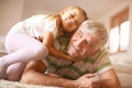 Grandpa with his granddaughter. Playing.