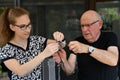 Granddaughter helps her grandfather to unravel a chain