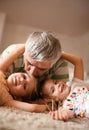 Grandpa and granddaughters playing. Royalty Free Stock Photo