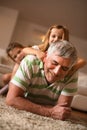 Grandpa and granddaughters playing. Royalty Free Stock Photo