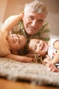 Grandpa and granddaughters playing. Royalty Free Stock Photo