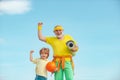 Grandpa and grandson spotting. Grandfather and child is doing sport outdoors. Different generations. Active family enjoy Royalty Free Stock Photo