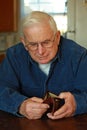 Grandpa looking in empty wallet