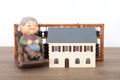 Grandpa model and small house model and calculation tool abacus Royalty Free Stock Photo