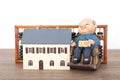 Old grandpa model and grandma model and small house model and calculation tool abacusGrandpa model and small house model and calcu Royalty Free Stock Photo