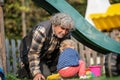 Grandpa playing with his granddaughter