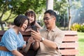 Grandparent enjoy with granddaughter in park surrounded with greenery and serenity. having joyful and cheerful time