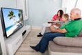 Grandparent And Grandchildren Watching Television Together Royalty Free Stock Photo