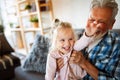 Grandparent playing and having fun with their granddaughter Royalty Free Stock Photo