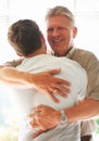 Grandparent, teenager and hug with smile, happy and embrace with love, grandchild and home. Senior man, support or
