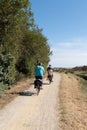 Grandparent on vacation with small children on bike during vacation summer in pathway Noirmoutier Island VendÃÂ©e France