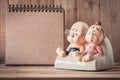 Grandparents ceramic dolls on wood background