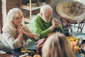 Grandparents charming couple gathering sit table celebrate thanksgiving day pray with family relatives have banquet in Royalty Free Stock Photo