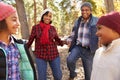 Grandparents With Children Walking Through Fall Woodland Royalty Free Stock Photo