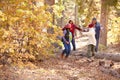 Grandparents With Children Walking Through Fall Woodland Royalty Free Stock Photo