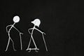 Grandparents day and seniors or old people social issues, rights and wellbeing concept. Elderly couple stick figure in dark black Royalty Free Stock Photo