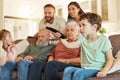 Grandparents, family tv and children in a home living room streaming a web series together. Senior people, kids and Royalty Free Stock Photo