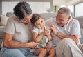 Grandparents, girl and sofa in house, happy and playing together in bonding time. Grandmother, grandpa and child on