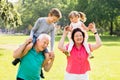 Grandparents Giving Grandchildren Piggyback Ride Royalty Free Stock Photo