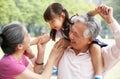 Grandparents Giving Granddaughter Ride