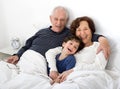 Grandparents grandchild bed Royalty Free Stock Photo