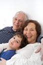 Grandparents grandchild bed Royalty Free Stock Photo