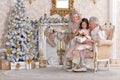 Grandparents with grandchild preparing for Christmas together Royalty Free Stock Photo