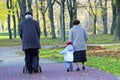 Grandparents and grandchild walking in the park