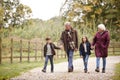 Grandparents With Grandchildren On Autumn Walk In Countryside Together Royalty Free Stock Photo