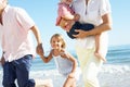 Grandparents And Grandchildren Enjoying Beach Royalty Free Stock Photo