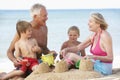 Grandparents And Grandchildren Enjoying Beach Holiday Royalty Free Stock Photo
