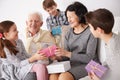 Grandparents and grandchildren exchanging gifts Royalty Free Stock Photo